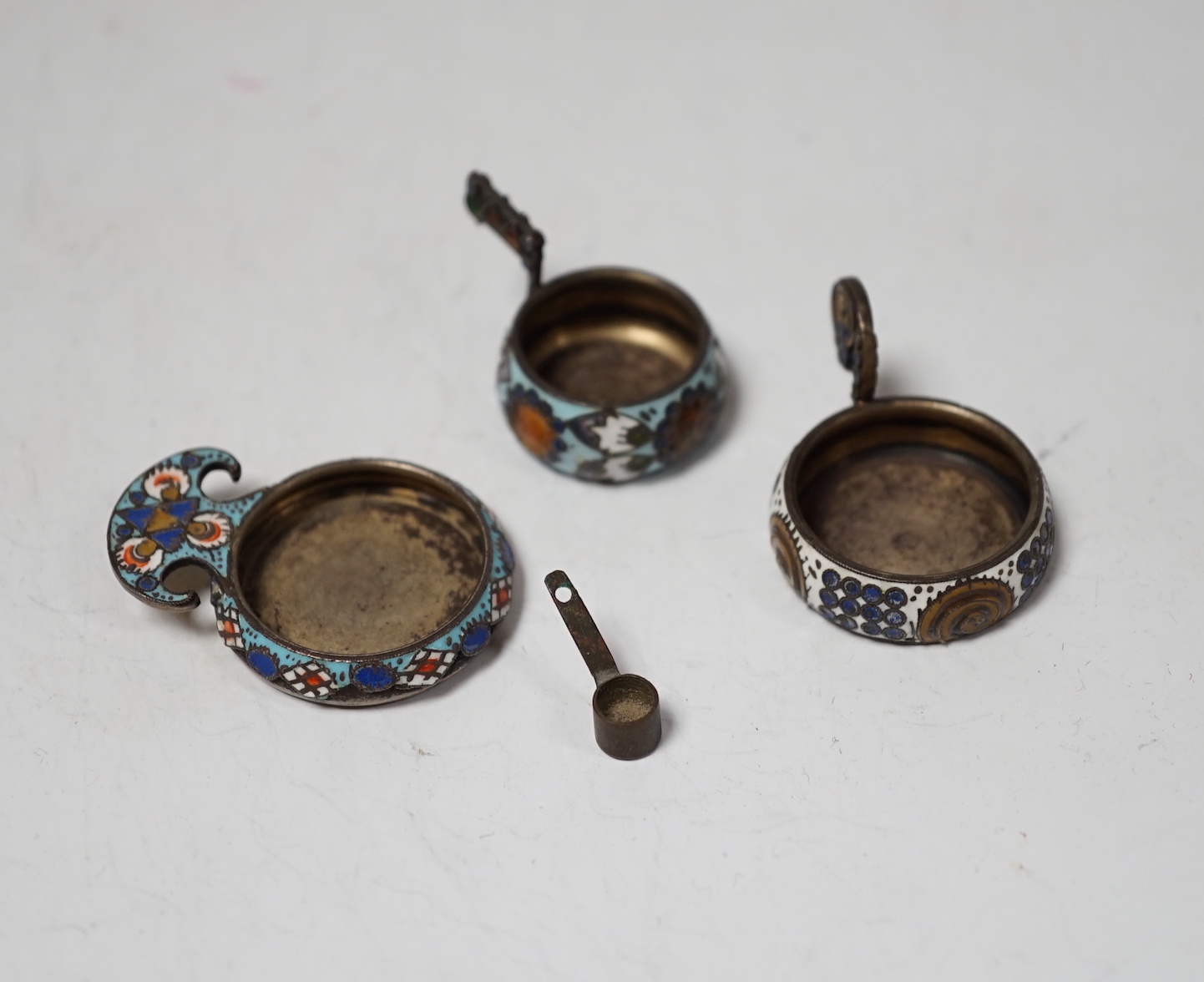 Three miniature late 19th/early 20th century Russian 88 zolotnik and cloisonné enamel single handled kovsh/dish
